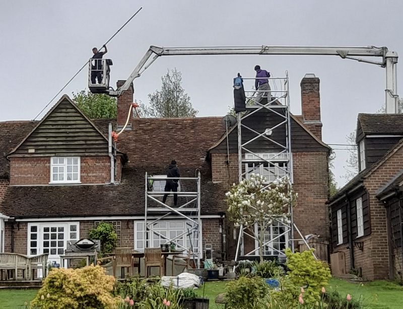 The Moss Cleaners using cherry picker and scaffolding to clean roof safely and professionally in Bradford-on-Avon, Wiltshire